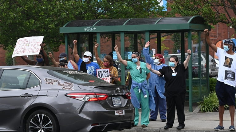 Health care workers protest outside Southside Hospital in Bay Shore...