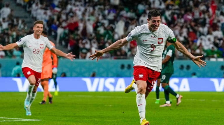 Poland's Robert Lewandowski celebrates scoring his side's 2nd goal during...
