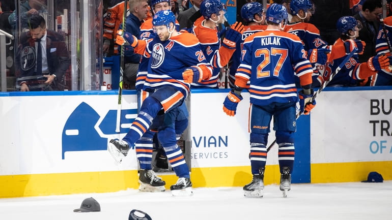 Edmonton Oilers' Leon Draisaitl (29) celebrates a hat trick against...
