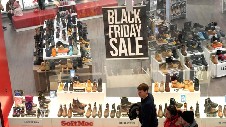 People shop at Mall of America for Black Friday deals,...