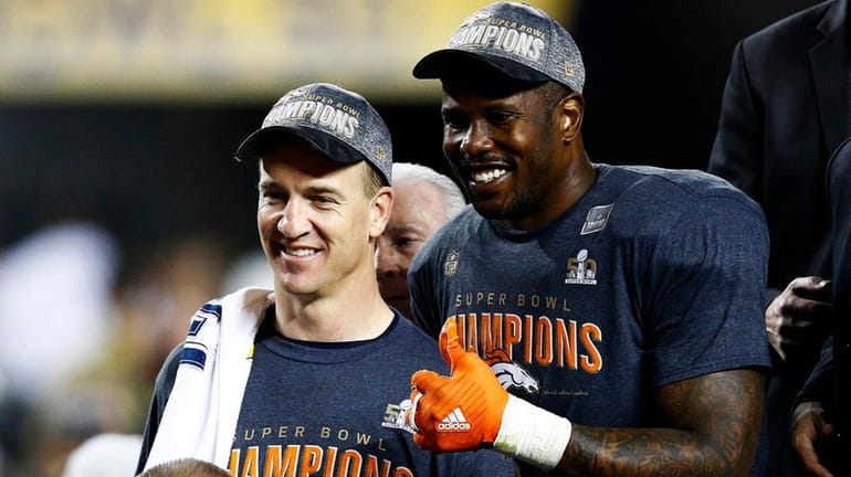 Peyton Manning and Von Miller of the Denver Broncos celebrate...