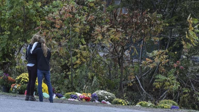 People mourn at the site of the fatal limousine crash...