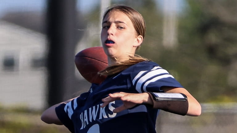 Plainview-Old Bethpage JFK quarterback Jen Canarutto throws winning extra-point conversion...