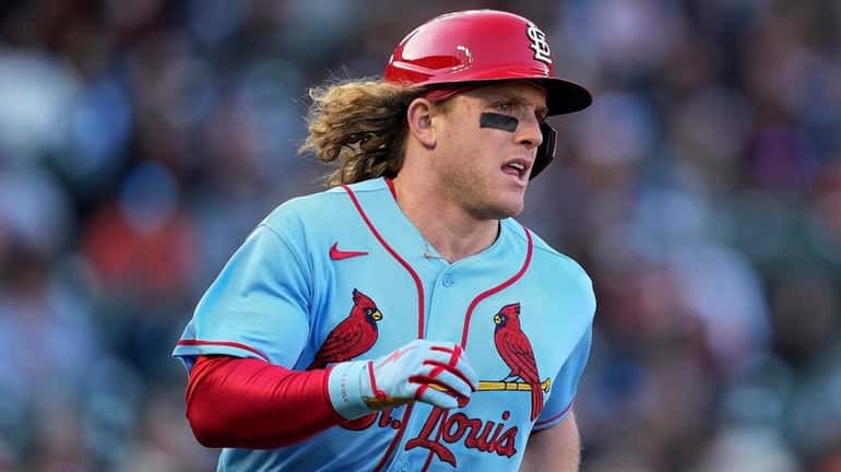 Harrison Bader runs to first base after hitting a single...
