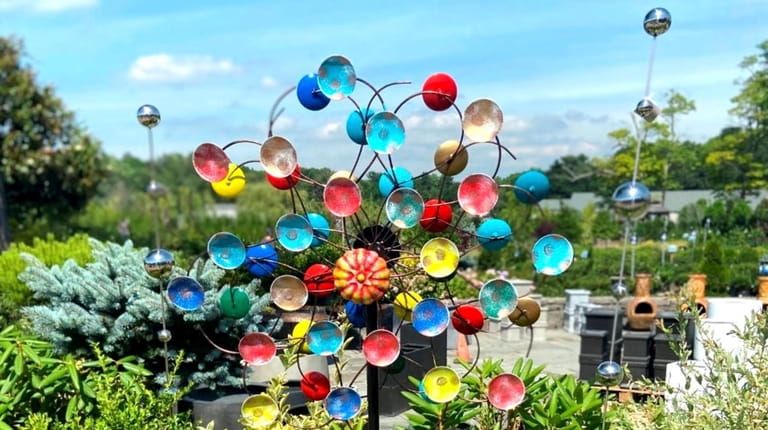 Sculptural wind spinner; $140 at Heritage Farm and Garden in...
