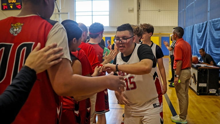 Plainedge’s Paul Beitnzinger shakes hands after their victory over Wheatley...