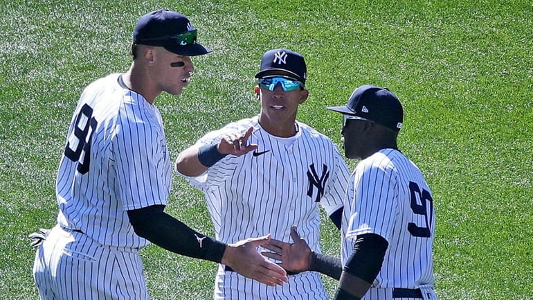 From left, Yankees outfielders Aaron Judge, Oswaldo Cabrera and Estevan...