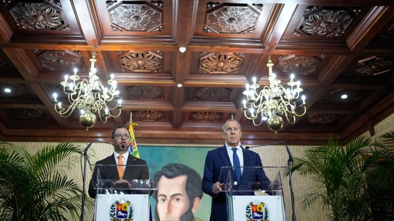 Russia's Foreign Minister Sergey Lavrov, right, and Venezuelan Foreign Minister...