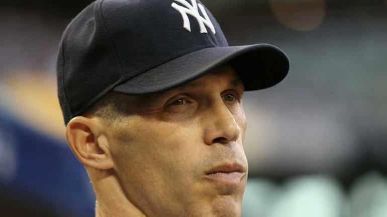 Manager Joe Girardi #28 of the New York Yankees looks...