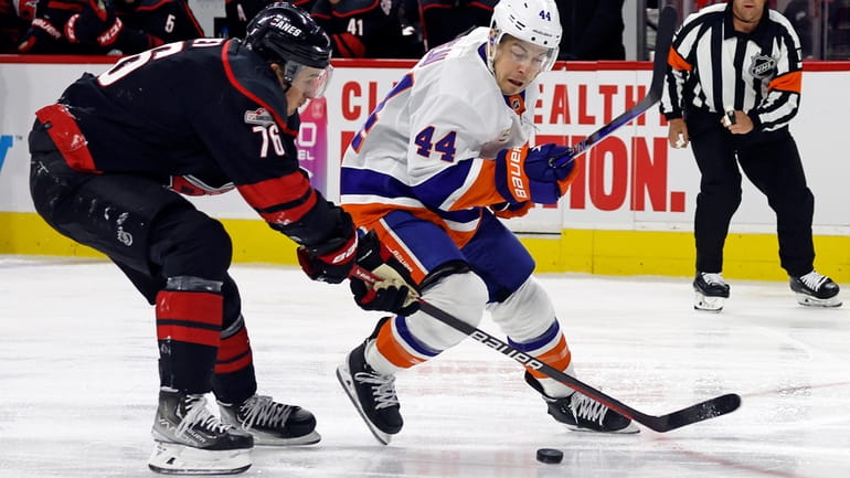 Islanders' Jean-Gabriel Pageau (44) loses control of the puck the...