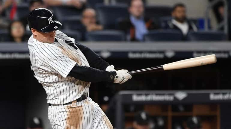 New York Yankees third baseman Chase Headley hits an RBI...