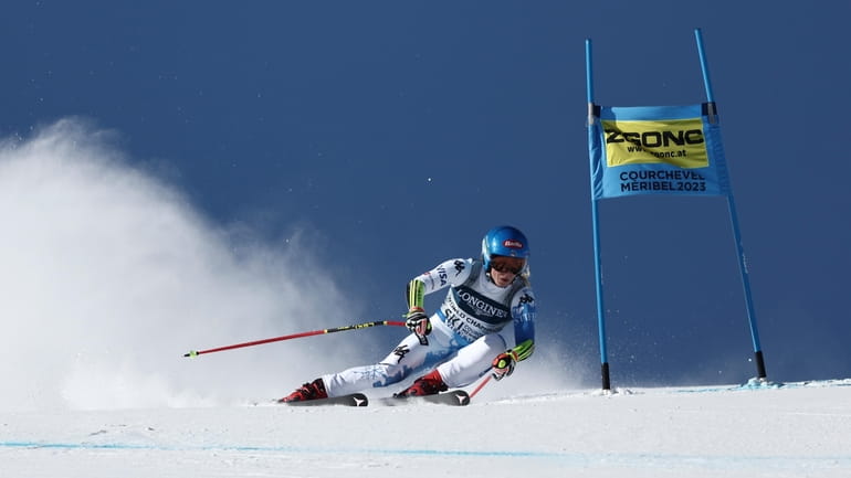 Mikaela Shiffrin speeds down the course during the super G...