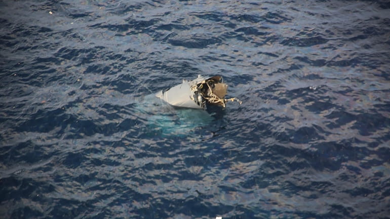 In this photo provided by Japan Coast Guard, debris believed...