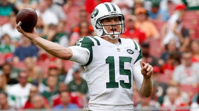 Josh McCown of the Jets throws to a receiver while...