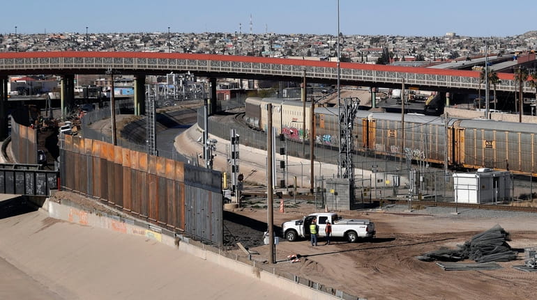 A new barrier is built along the Texas-Mexico border near...