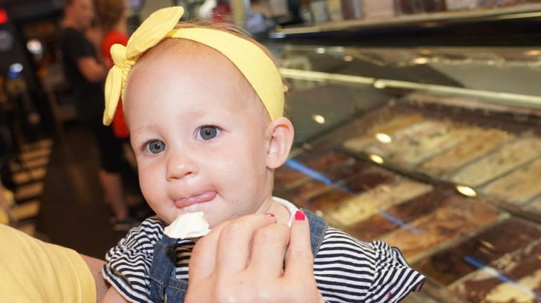 Lucia Cimino of Holbrook ,15 months, samples vanilla ice cream...