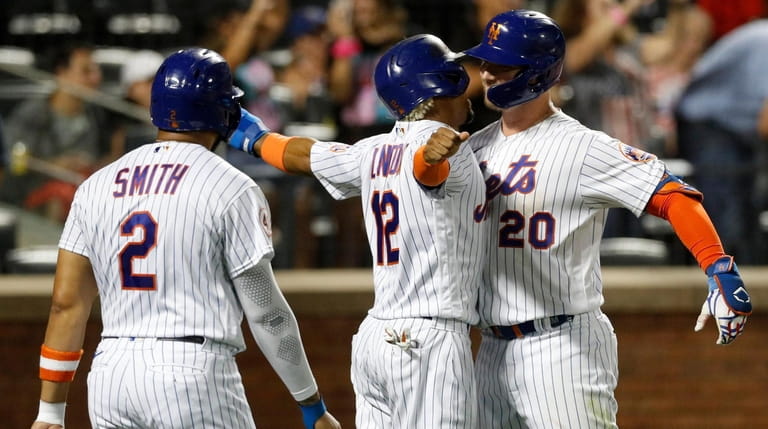 Pete Alonso of the New York Mets celebrates his three-run...