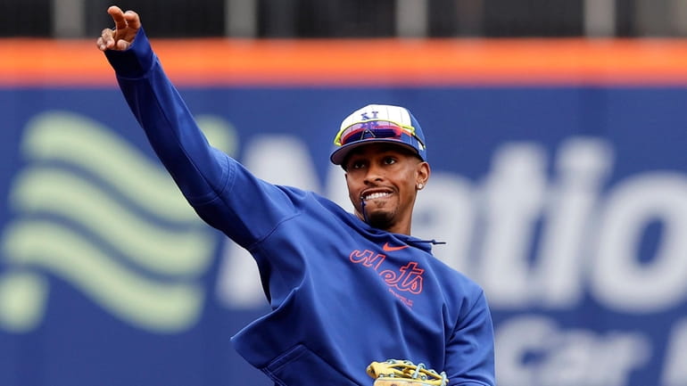 Francisco Lindor #12 of the New York Mets works out...