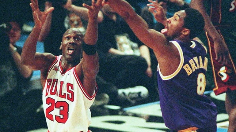 The Chicago Bulls' Michael Jordan, left, and the Los Angeles...
