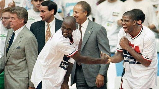 USA's Earvin "Magic" Johnson, right, and Michael Jordan shake hands...