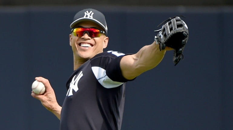 Yankees Giancarlo Stanton works out on the field during Yankee...