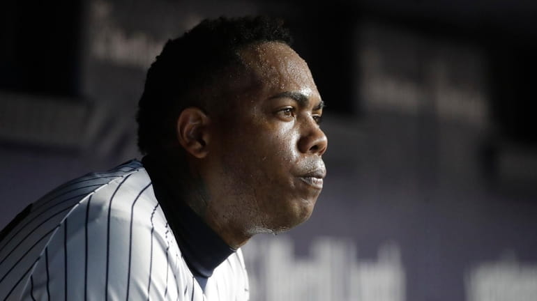 New York Yankees relief pitcher Aroldis Chapman sits in the...