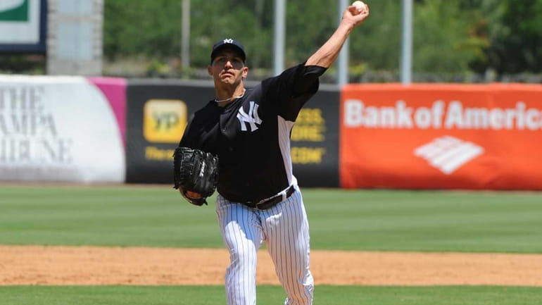Andy Pettitte throws against the New York Mets in a...