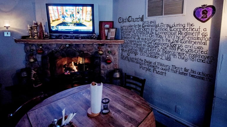 Elijah Churchill's, a bar in Northport, features the story of...
