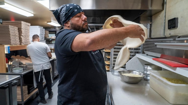 Michael Esposito, the creative force behind Mike's Pizza in Amityville.