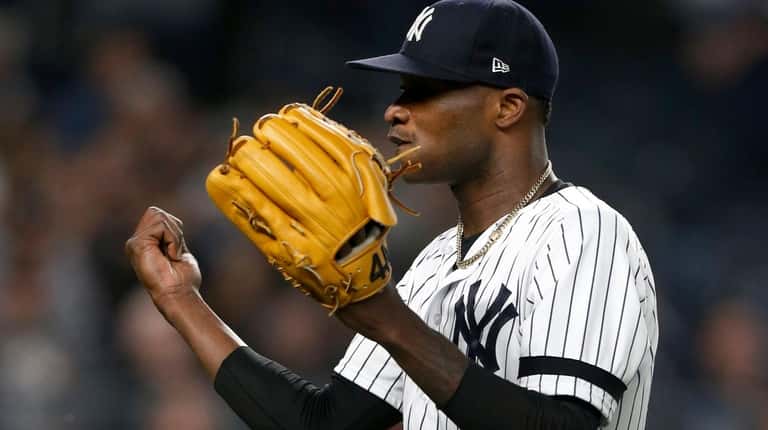 Domingo German #55 of the New York Yankees reacts after...