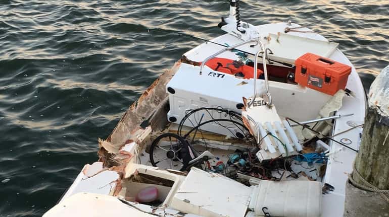 The 16-foot center console HSX boat after it was struck...