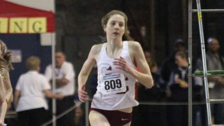 Garden City's Emma Gallagher runs in the 600 meter run....