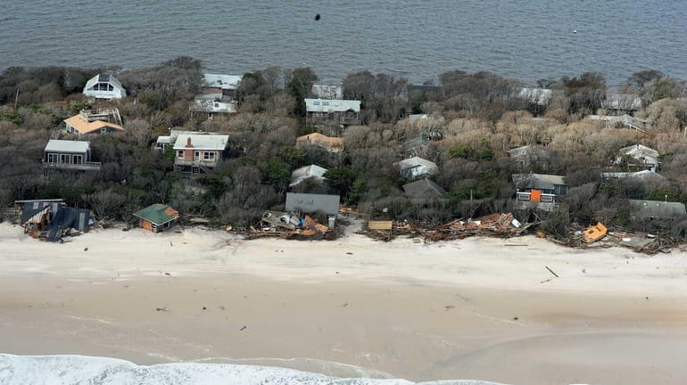 Aerial views showing debris from destroyed oceanfront homes on Davis...
