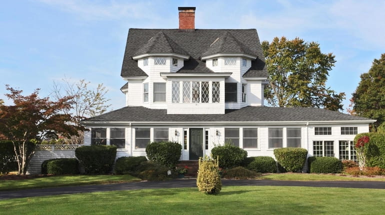 This Bay Shore home, built in 1897, includes a four-bedroom guest...