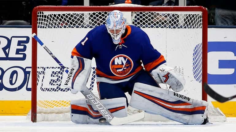 Thomas Greiss of the Islanders defends the net during the first...