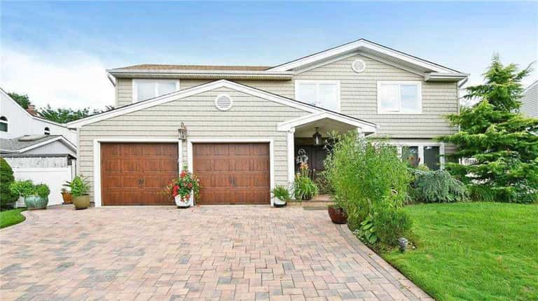 Priced at $948,000 and located at 9 Fams Drive in...