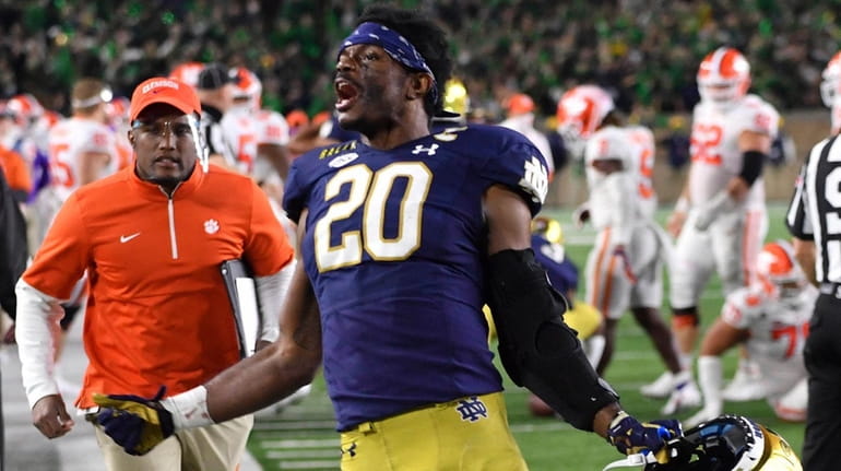 Notre Dame safety Shaun Crawford celebrates after Notre Dame defeated...