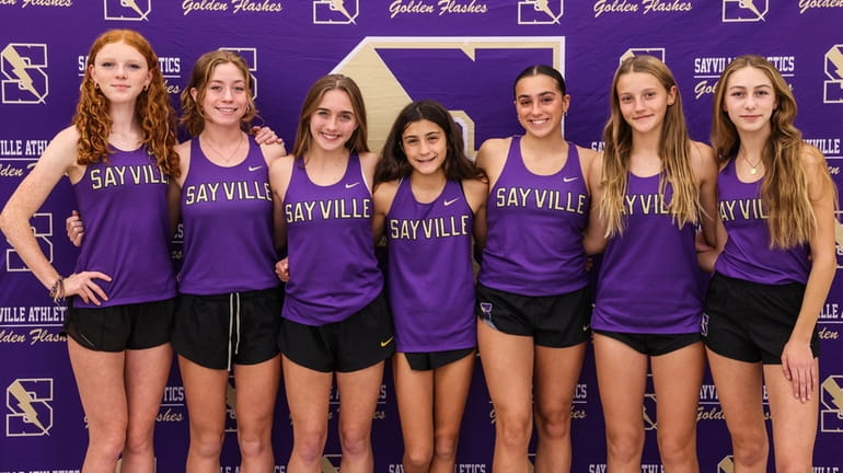 The Sayville Golden Flashes girls cross country team that won...