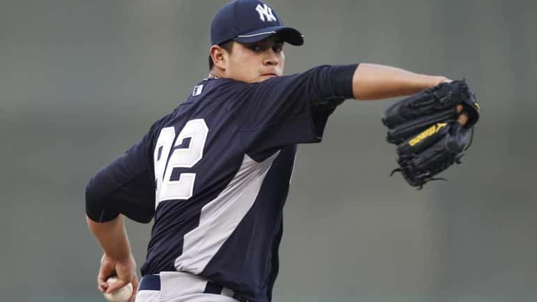 Lefthander Manny Banuelos pitches for the Yankees in a spring...