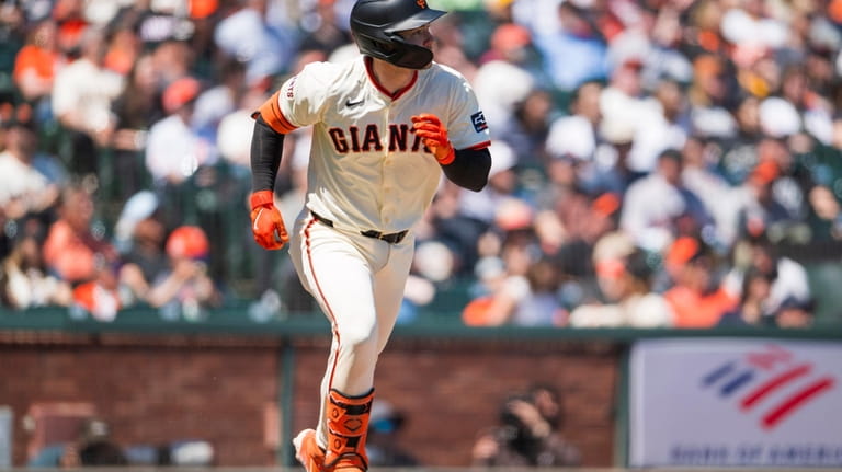 San Francisco Giants' Patrick Bailey watches his hit as he...