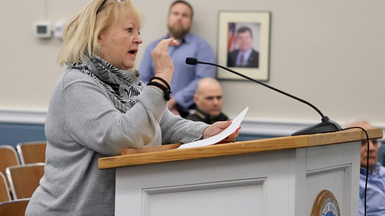 Teri Kroll, of Lindenhurst, voiced concerns over the zoning change at...