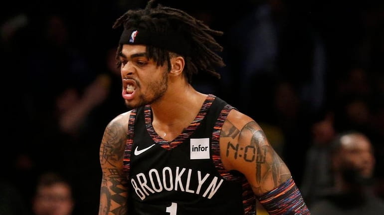 Nets guard D'Angelo Russell celebrates a three-point basket late during the...