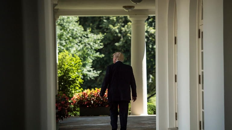 President Donald Trump seen walking through the White House.