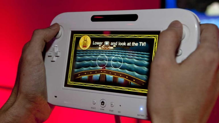 Nintendo's Wii U video game console is demonstrated at the...