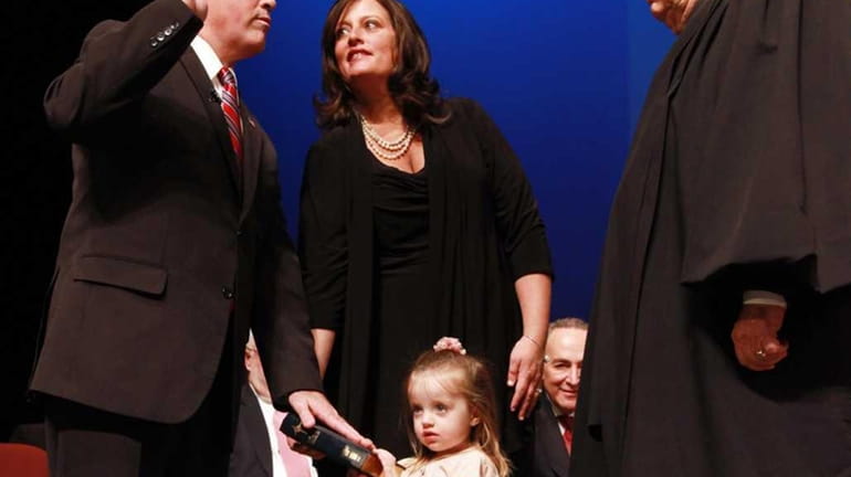 Steve Bellone is sworn in as his wife, Tracey Bellone,...