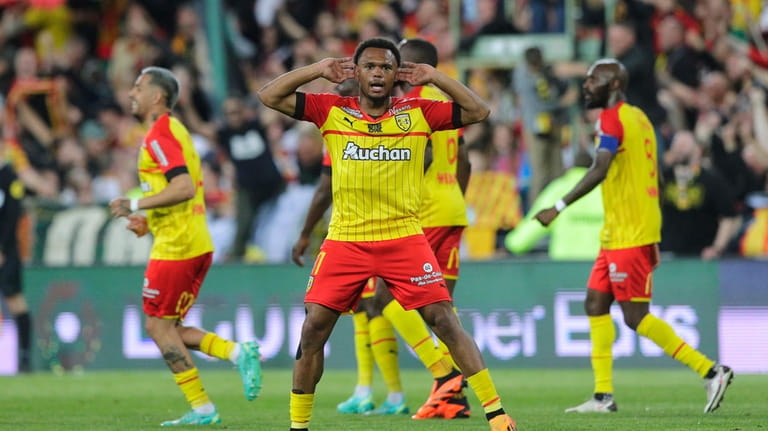 Lens' Lois Openda reacts after scoring during a French League...