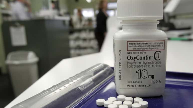 OxyContin pills are shown at a pharmacy in Montpelier, Vt....