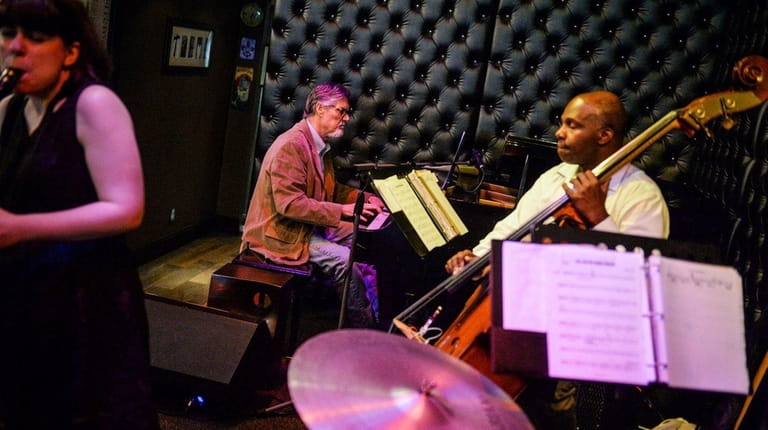 Lepley, center, plays with bassist James Cammack at Treme in...