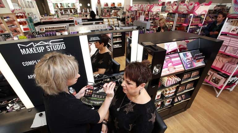Ellen Tjimos of Bethpage sits for a makeup session with...
