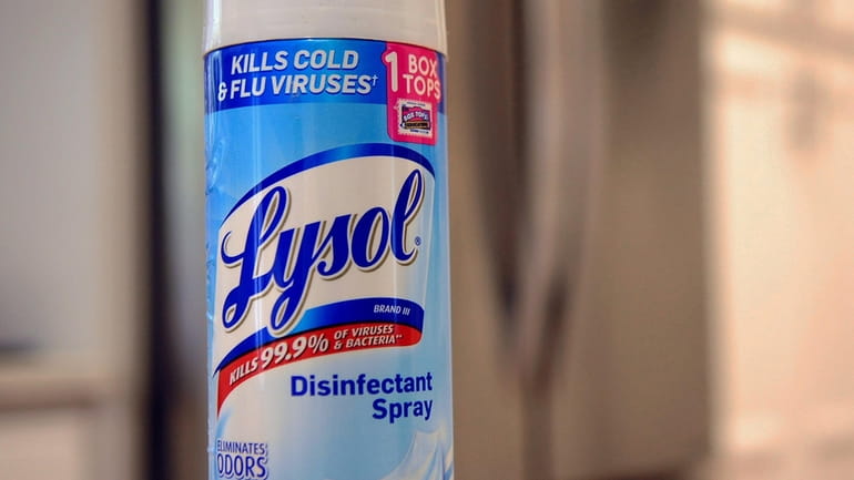 A can of Lysol disinfectant spray is seen in this...